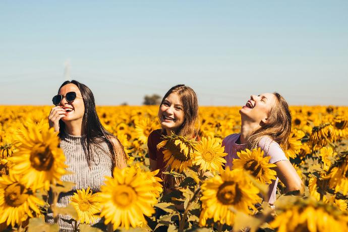 Image of a group of girls and flowers